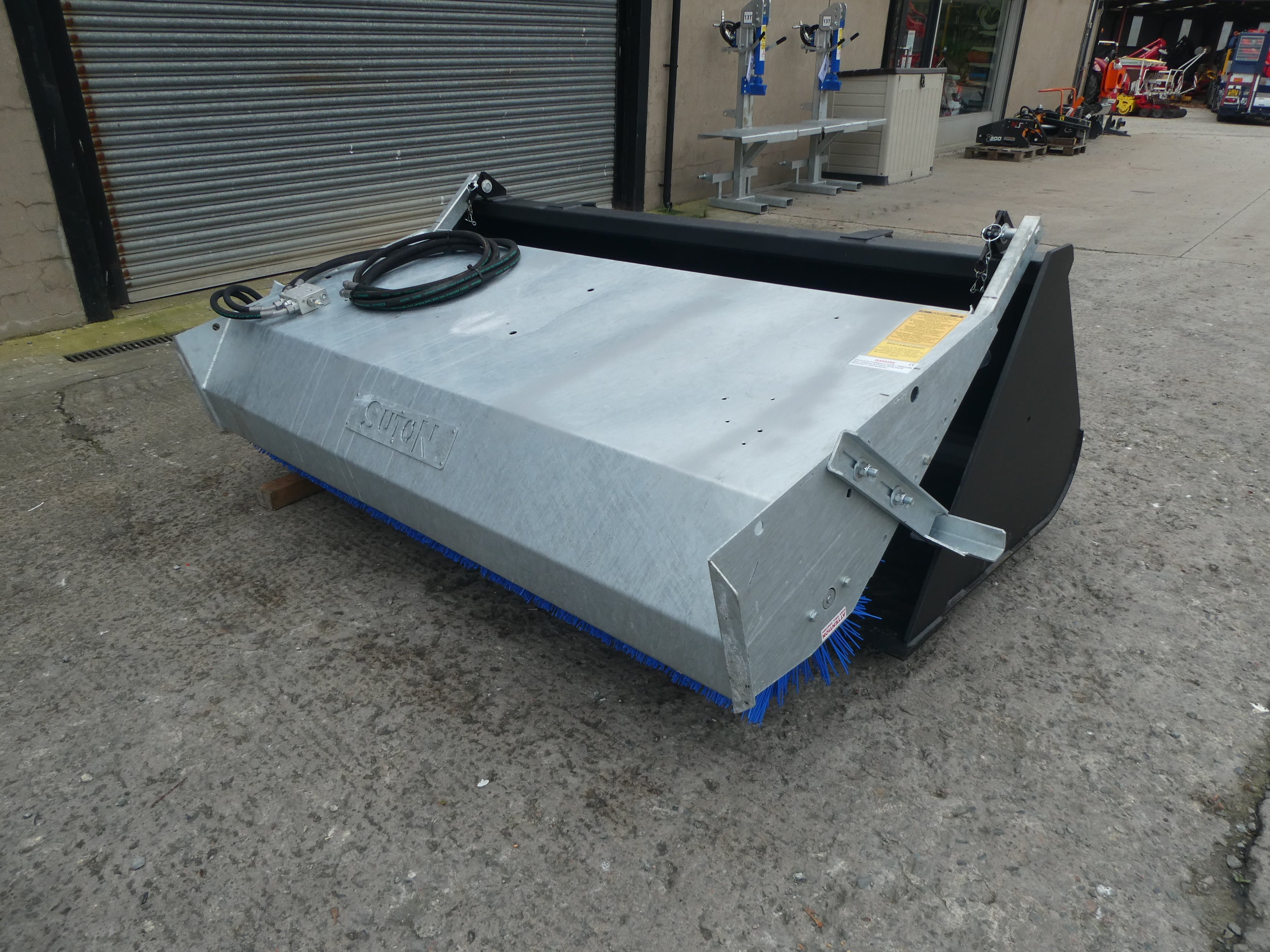 Suton Bucket Brush mounted on bucket
