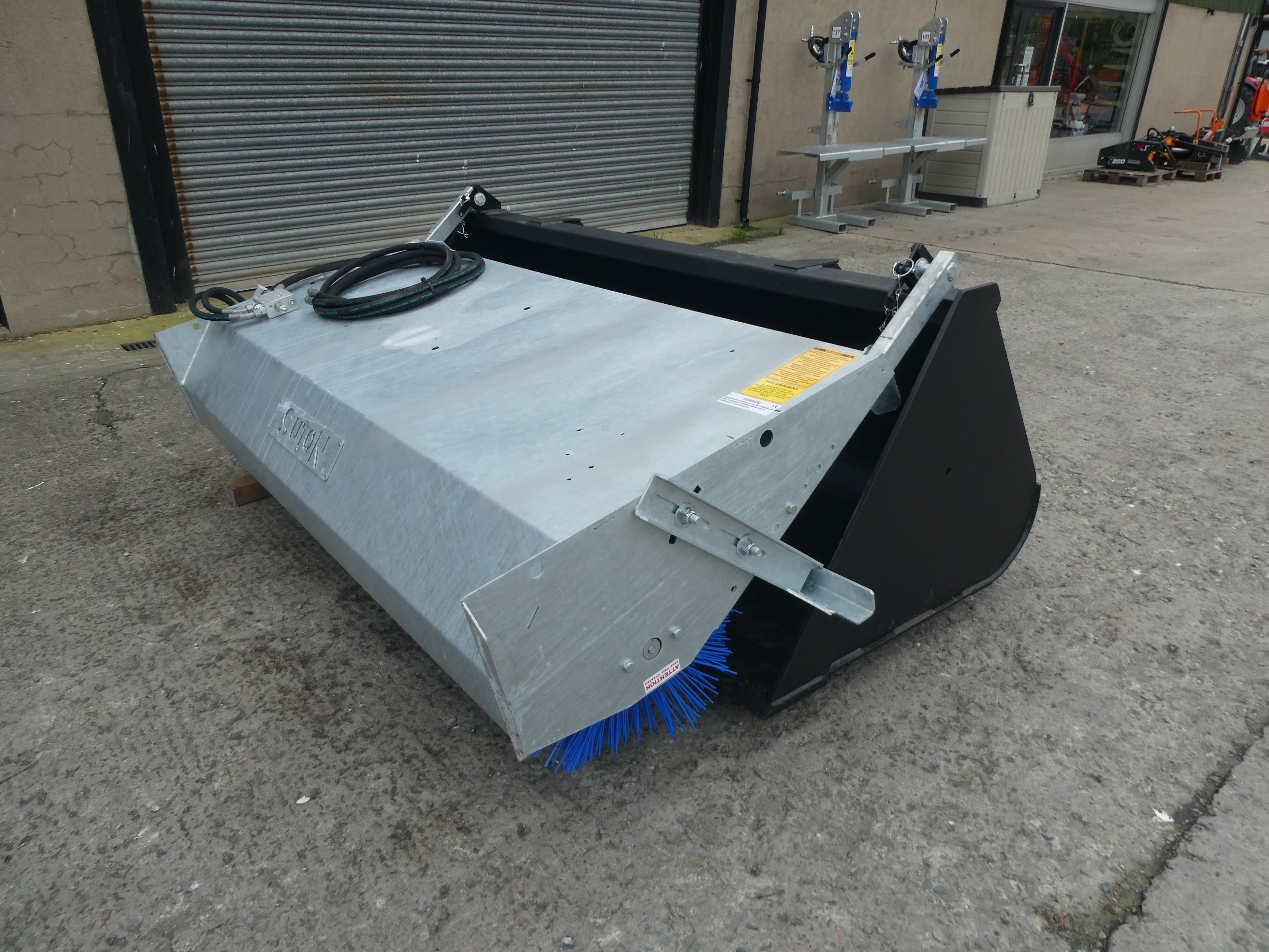Suton Bucket Brush mounted on bucket