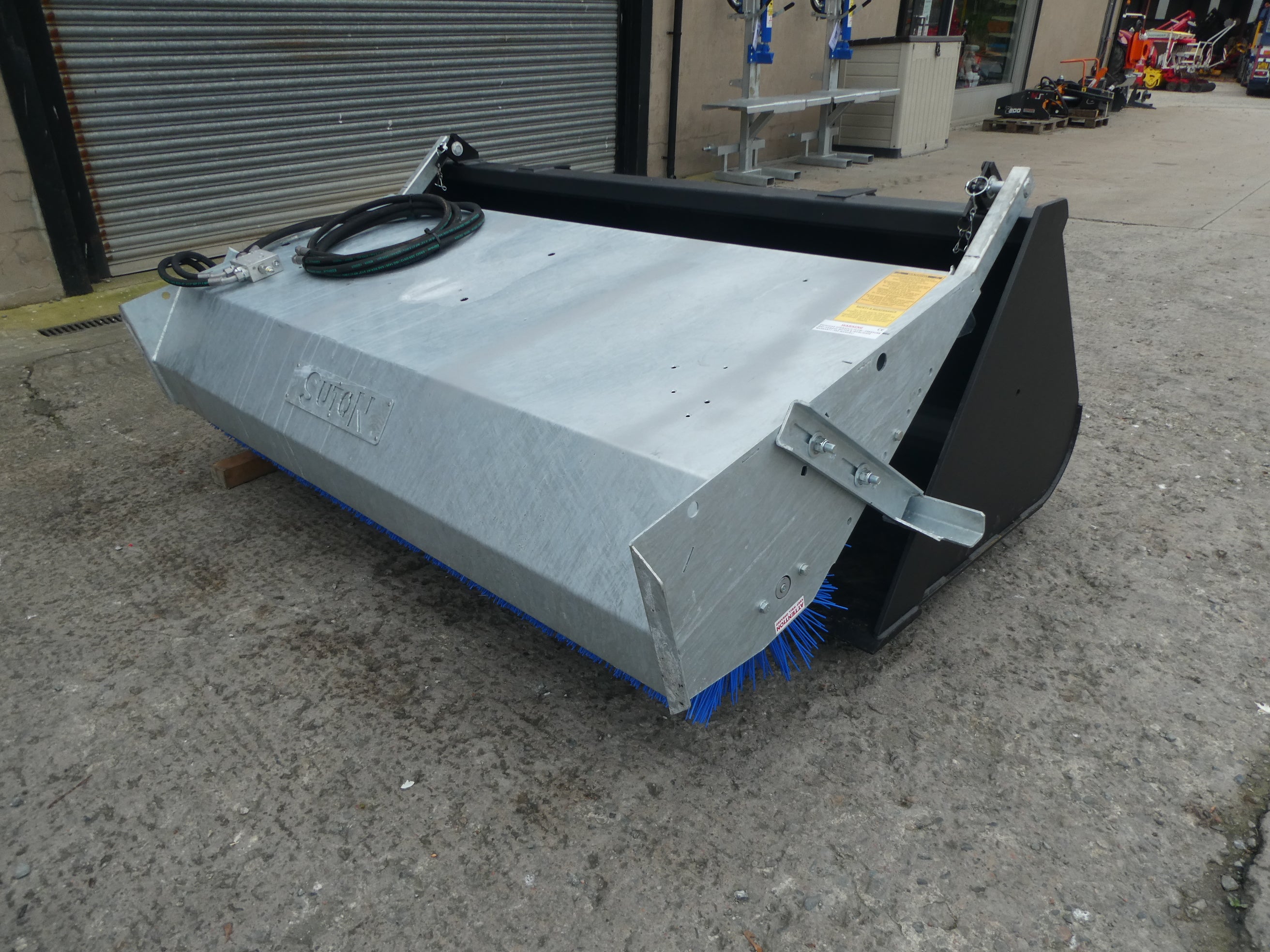 Suton Bucket Brush mounted on bucket
