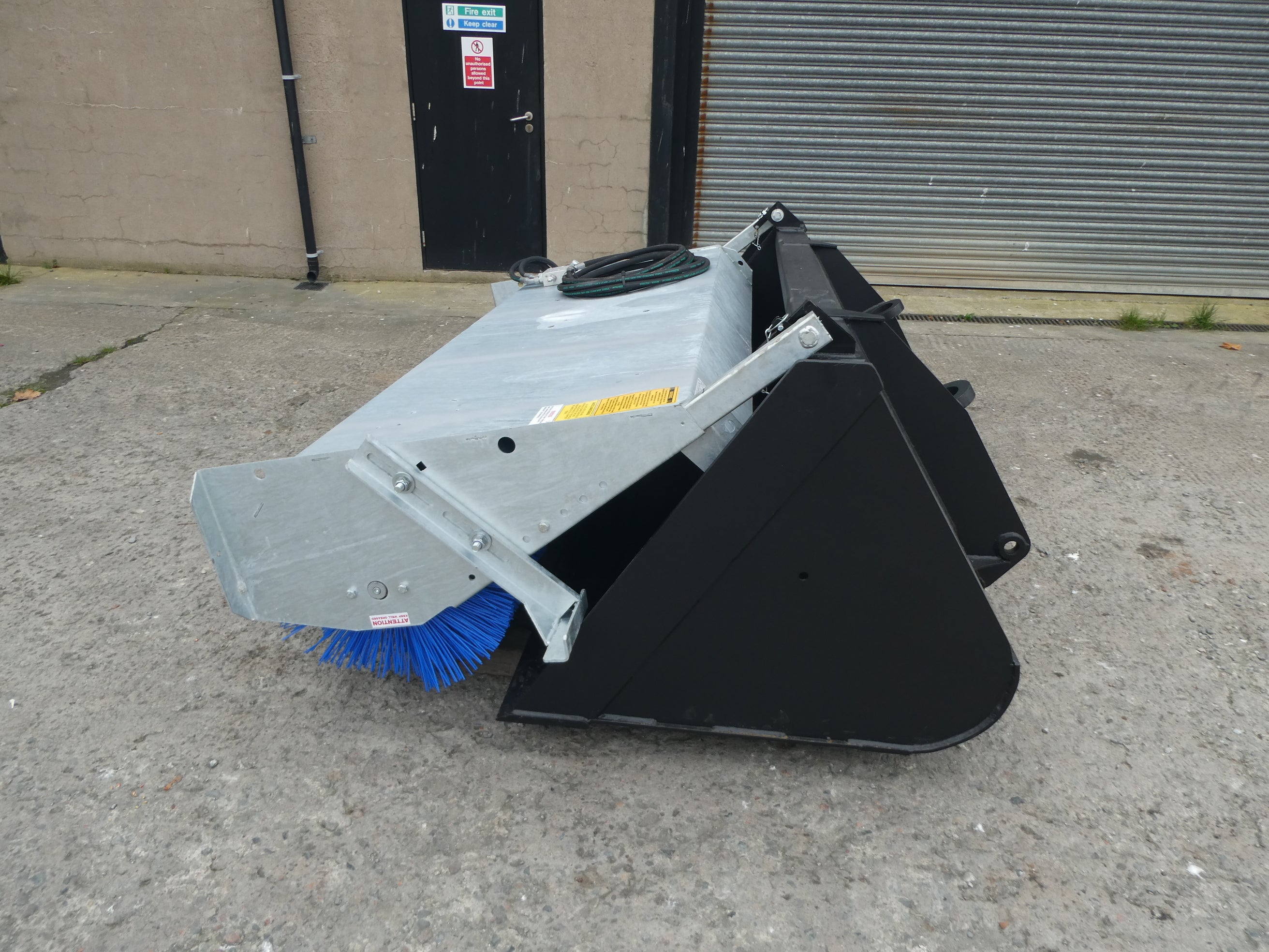 Suton Bucket Brush mounted on bucket