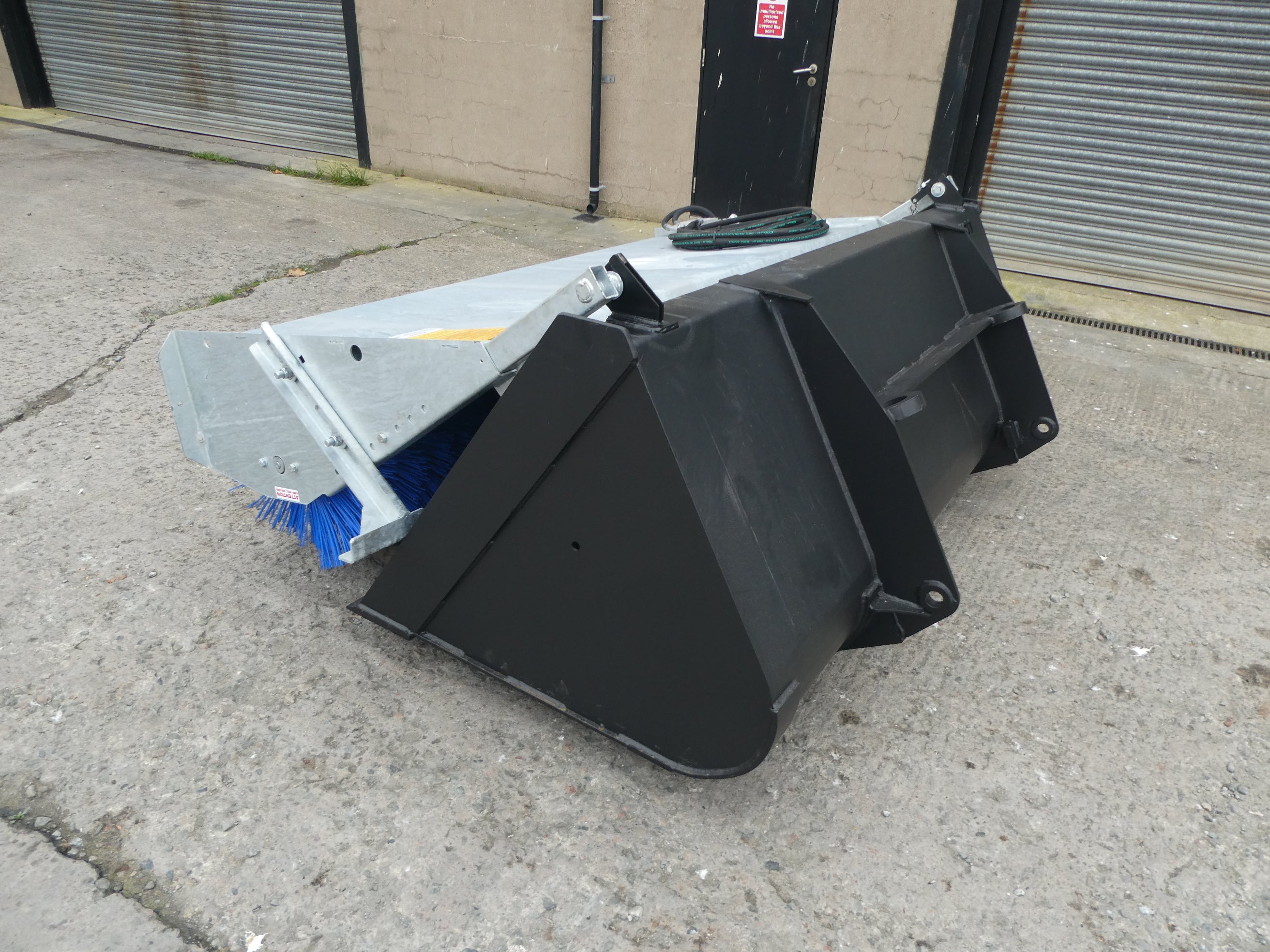 Suton Bucket Brush mounted on bucket