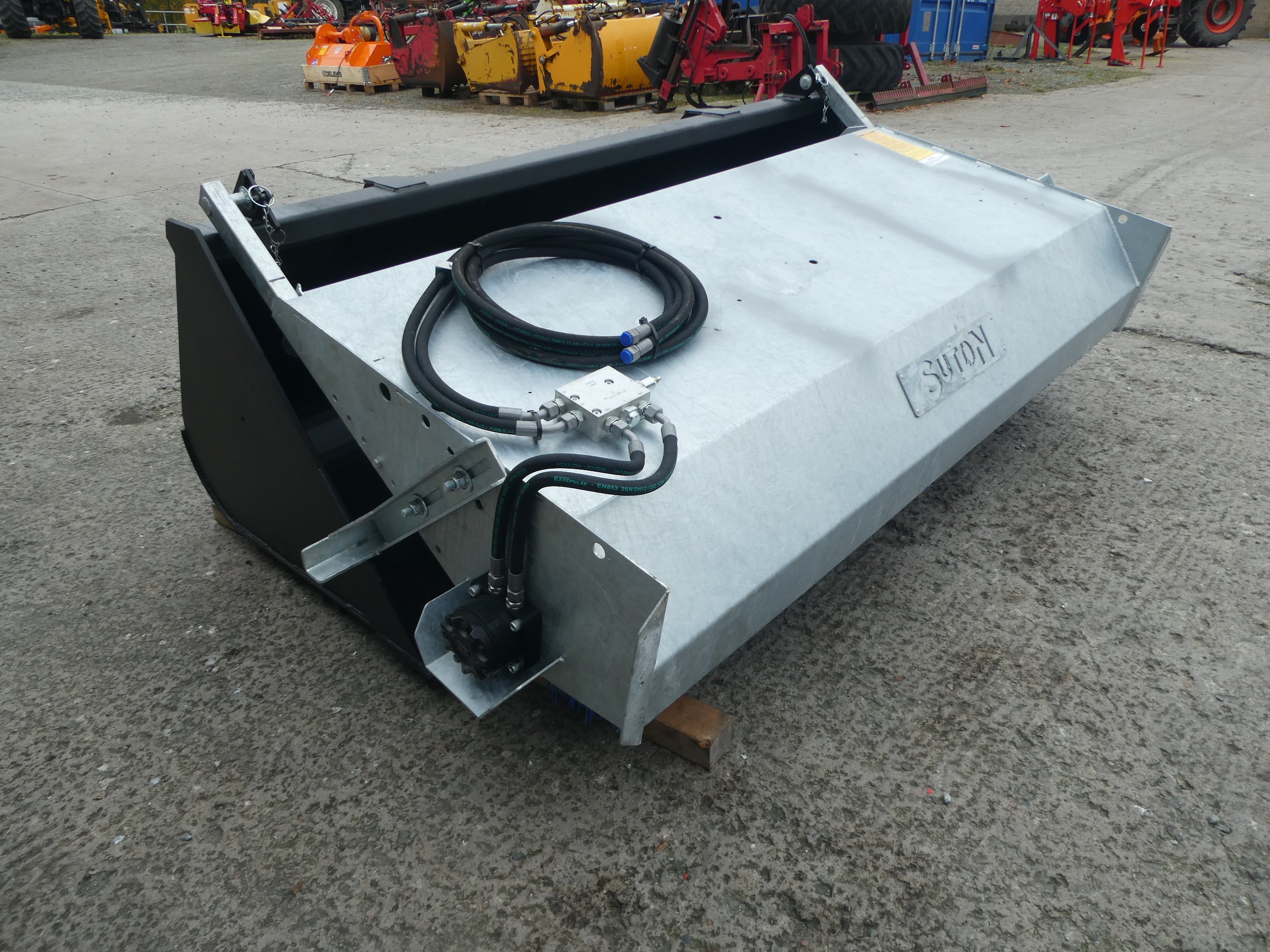 Suton Bucket Brush mounted on bucket